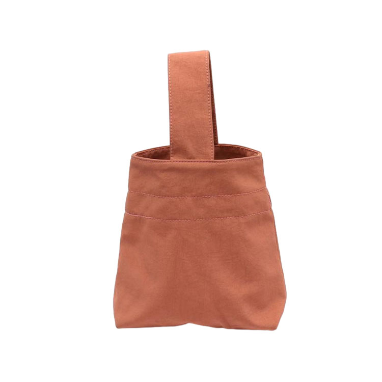 Hvordan er materialet og holdbarheden af ​​håndtasken?